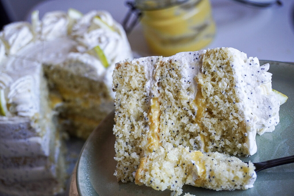 Lemon Poppy seed Cake with Lemon Curd and Fresh Cream cake slice