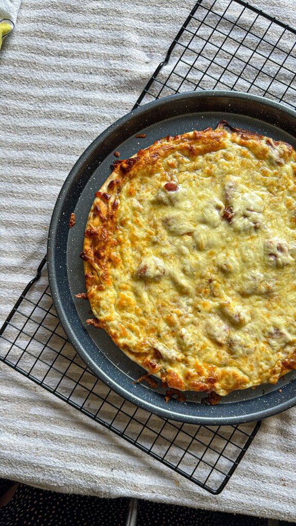 How to Make a Store-Bought Pizza Extra Cheesy 0cd87c4d d60b 488e 94cf f59f8345fe43.jpg