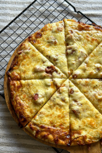 How to Make a Store-Bought Pizza Extra Cheesy